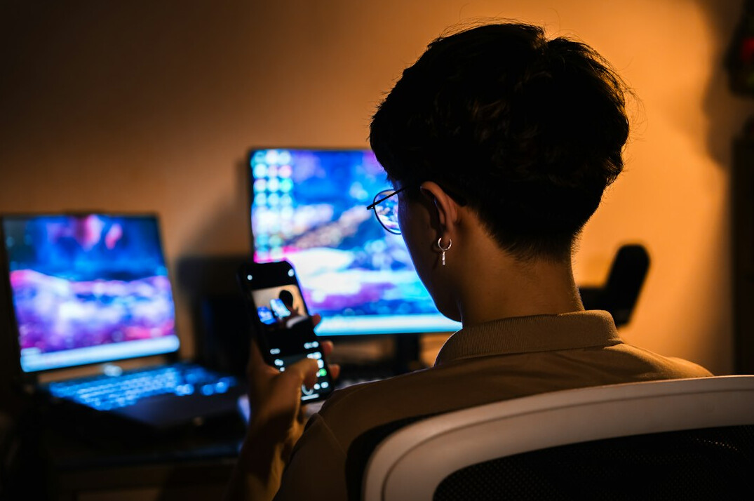 person using smartphone at home