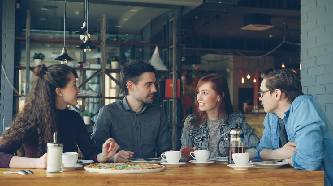 people discussing in cafe
